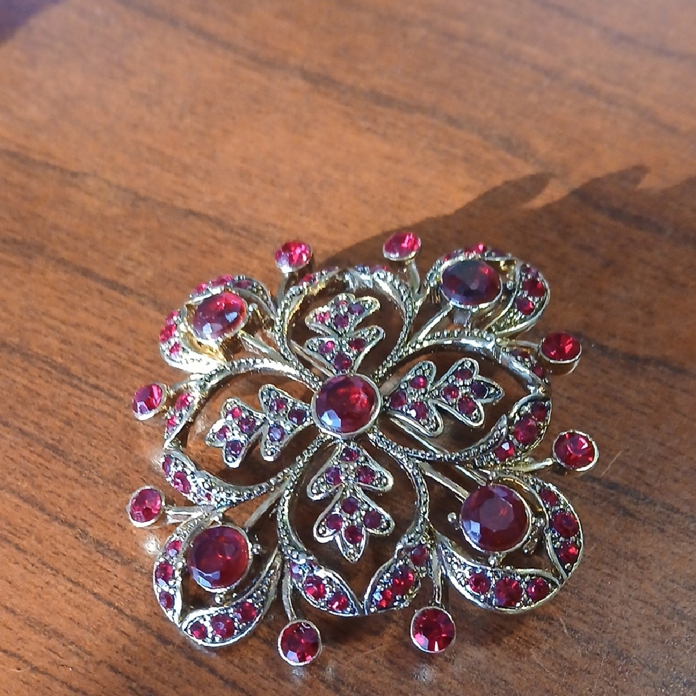 Elegant Gold and Red Brooch
